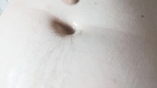 Rubbing cum in my belly button - 2 image