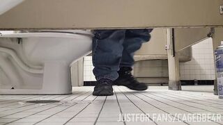 Caged sub offering his hole under the stall - 4 image