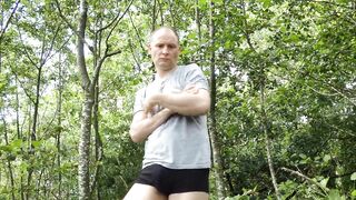 Kudoslong is outside in the woods in just a grey t-shirt and black boxer briefs strips and wanks - 3 image