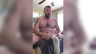 Amputee slowly takes off prosthetic to rub oil on his stump and body - 3 image
