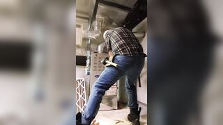 HVAC dad working on customer's heater - 1 image