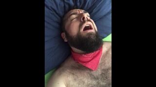 Big bearded and hairy bear wanking rubbing the bed sheet on his hard and wet cock. Beautiful Agony - 1 image