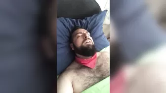 Big bearded and hairy bear wanking rubbing the bed sheet on his hard and wet cock. Beautiful Agony