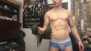Chris Wild doing biceps curls and masturbates his big cock - 1 image
