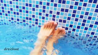 Feet in the pool with water - 1 image