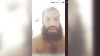 Arab with beard strokes his cock - 3 image