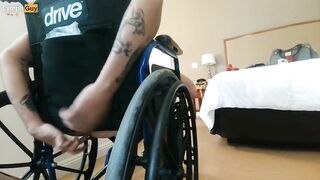 Handicapped guy wheels around hotel room naked in wheelchair - 9 image