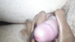 a young handsome man jerks off a penis with a leather glove and cums with a powerful stream of sperm - 2 image