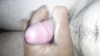 a young handsome man jerks off a penis with a leather glove and cums with a powerful stream of sperm - 6 image
