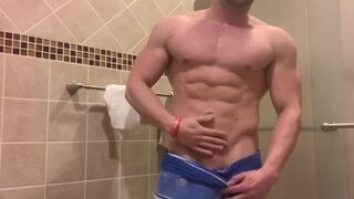 Jacked Alpha Male Flexes in Just Towel - 1 image
