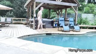 Security guard having fun with trespasser by the pool - 2 image
