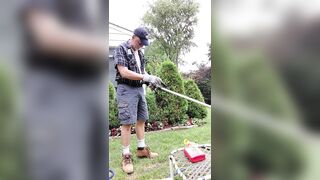Daddy gardener doing yard work and hosing off - 1 image
