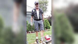 Daddy gardener doing yard work and hosing off - 2 image