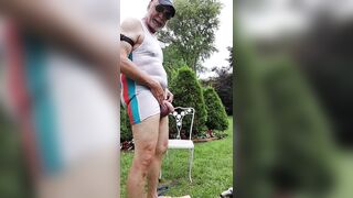 Dad hosing off in the yard - 9 image