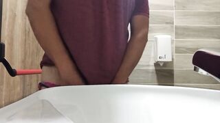 long pee like fountain in a public toilet - 3 image
