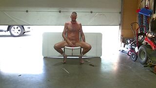 naked mastro in garage with door up - 2 image