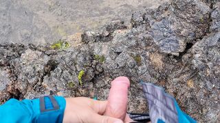 Cliffwanker - Felixproducer wanks on a rock and shoots his sticky load of sperm down that cliff - 1 image
