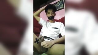 Asian boy takes a big load - 2 image