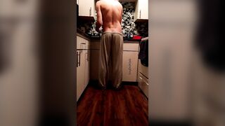 Pants slowly fall down while doing dishes - 3 image