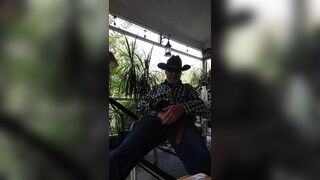 Cowboy dad pumps cock,and nips sitting on back porch - 2 image