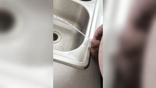 Chubby cub pissing in the sink - 3 image