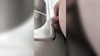 Chubby cub pissing in the sink - 7 image