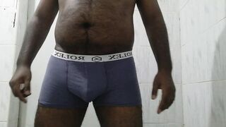 An Asian black boy pissing in his underwear - 1 image