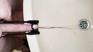 Pissing with cock stretched - 4 image
