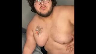 Chubby boy plays with his big tits - 1 image