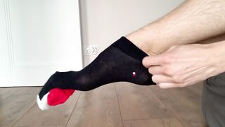 hot boy puts socks on his feet - 2 image