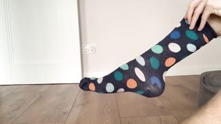hot boy puts socks on his feet - 8 image