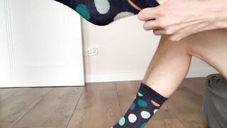 hot boy puts socks on his feet - 9 image