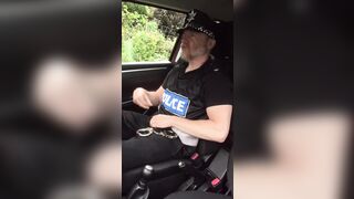 Muscular cop jerks off in police car beside busy road. - 2 image