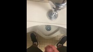Jerking off in a public urinal - 1 image