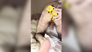 Bald bearded blue-eyed white otter in cute onesie pajamas strips down to tease very hairy ass with a gaming controller - 10 image