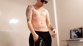 Hot tattooed guy jerking his young cock off in the shower to MILF porn - 2 image