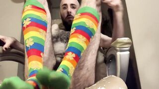Very hairy skinny white guy in rainbow knee-high socks gives a realistic dildo footjob - 2 image