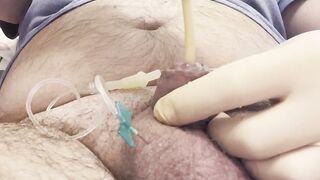 Inserting a large catheter into a small cock with big balls - 7 image