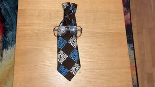 Cum on ugly glasses and ugly tie. - 1 image