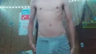 Hung 19 year old twink striping to low music - 1 image