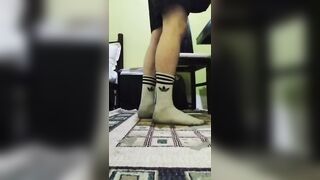 Cute twink showing his dirty white socks, while he listening to music and singing. - 1 image