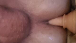 lying in bed and riding a dildo and jerking off my cock - 1 image