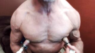 Gay Nipple Pig pumping up his giant nipples