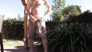 In my backyad with cargo shorts on