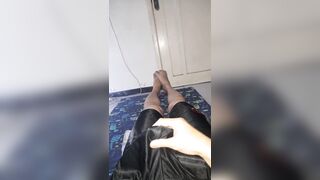 Pleasure wearing shiny slippery black shorts bulge