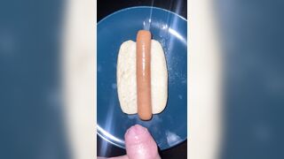 Huge watery cumshot on hotdog
