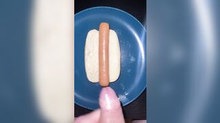 Huge watery cumshot on hotdog