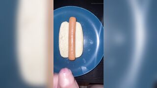 Huge watery cumshot on hotdog