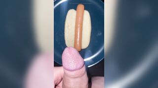 Huge watery cumshot on hotdog