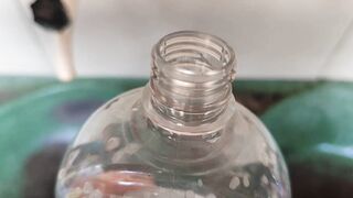 Malleable stick in the disinfectant bottle of the young straight slave. - 4 image